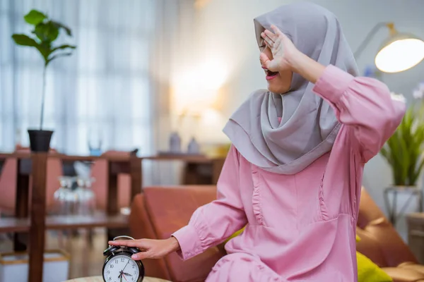 tired muslim woman wake up early to have a morning breakfast on fasting month. sahur concept in ramadan