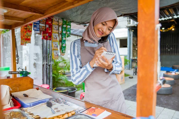 Beautiful Muslim Seller Taking Order Customer Phone — стоковое фото