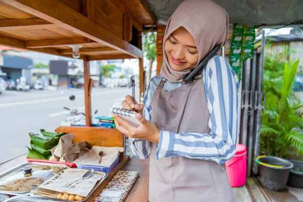 Beautiful Muslim Seller Taking Order Customer Phone — Stock Fotó