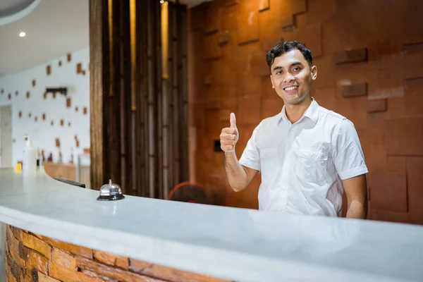 Receptionist Smiling Thumbs While Standing Hotel Reception Desk Background — 图库照片