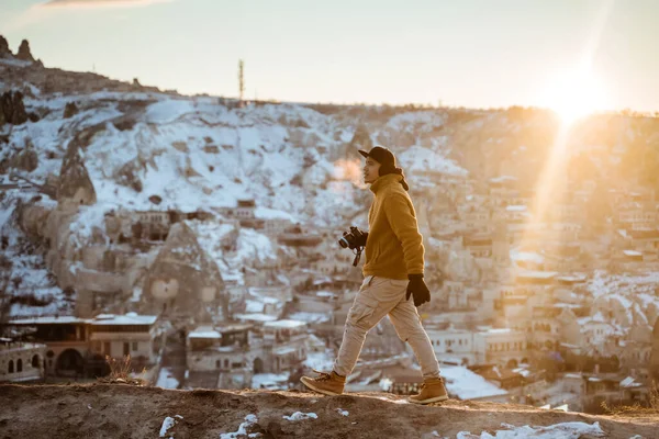 Young Asian Man Walking Alone Beautiful Snowy Landscape Holding Camera — Stok fotoğraf