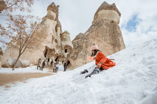 Happy Little Girl Red Sliding Pile Snow Pasabag Valley Cappadocia — 스톡 사진