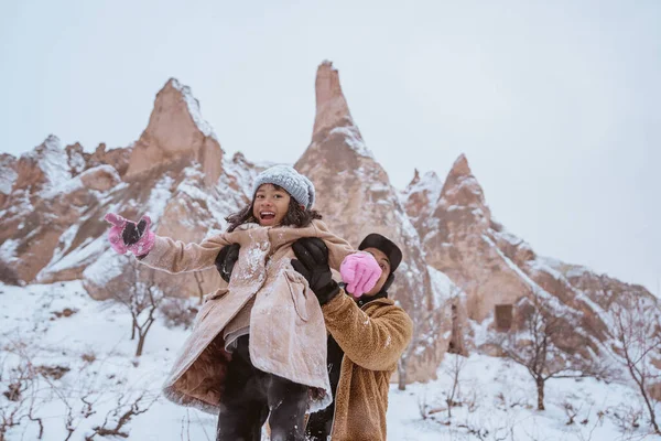 Father Giving Piggyback Ride His Daughter While Playing Snow — 스톡 사진