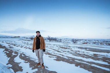portrait of asian man hiking on beautiful natural landscape in cappadocia turkey