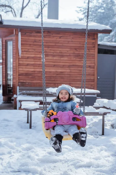Cute Toddler Swinging Playground Cover Snow Winter — 스톡 사진
