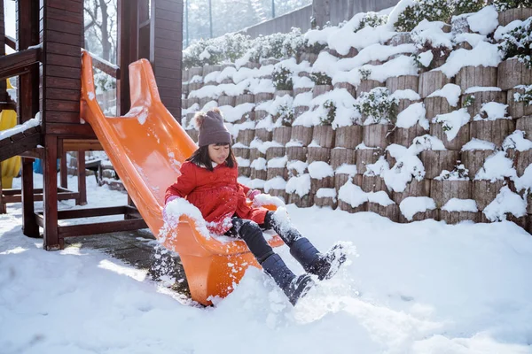 Little Girl Sliding Slide Winter Playground Full Snow — 스톡 사진