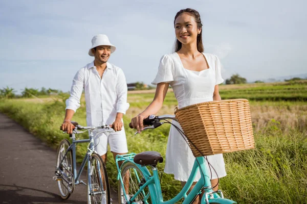 Attractive Asian Woman Her Boyfriend Having Fun Riding Bicycle Outdoor — 图库照片