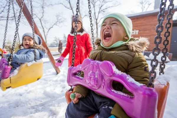 Boy Toddler Swinging Playground Cover Snow Winter — 스톡 사진