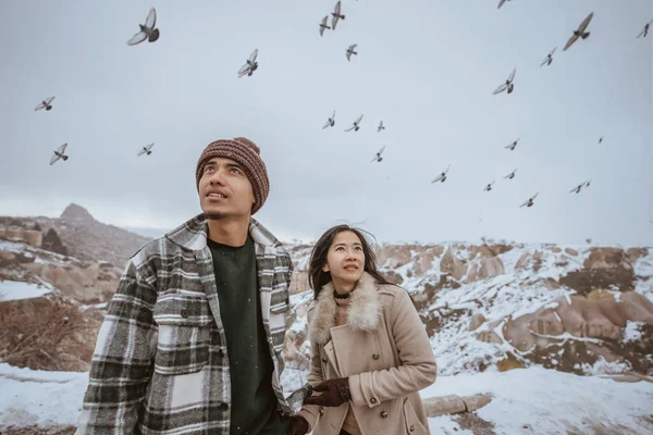 Portrait Couple Looking Sky While Pigeon Flying Circling Them — Stockfoto