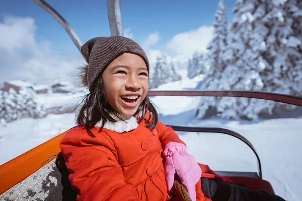 Portrait Excited Young Girl Riding Ski Lift Going Top Snowy — 스톡 사진
