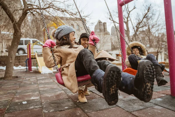 Father Help Swinging His Daughter Playing Playground Winter — 스톡 사진