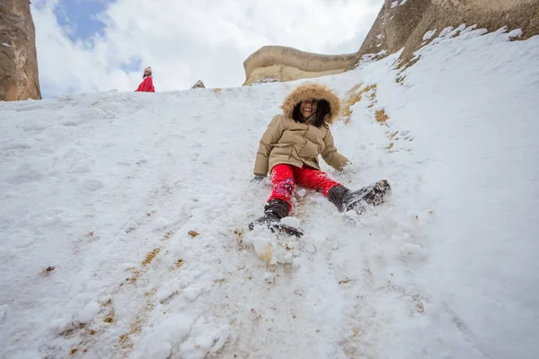 Happy Little Girl Sliding Pile Snow Pasabag Valley Cappadocia — 스톡 사진