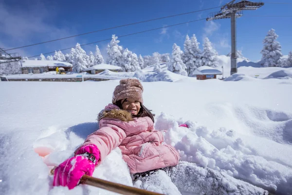 Happy Little Girl Burried Half Her Body While Playing Snow — 스톡 사진