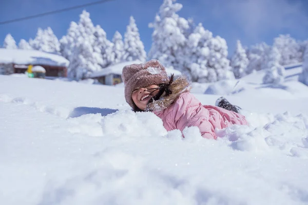 Happy Little Girl Burried Half Her Body While Playing Snow — 스톡 사진