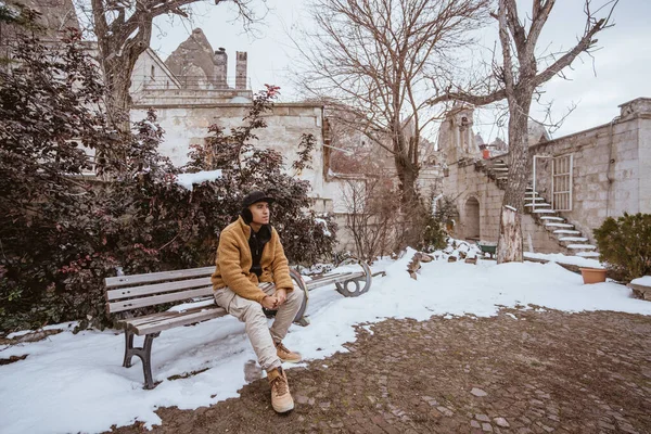 Handsome Male Sitting Bench Old Historical Building Some Snow — Stock Photo, Image