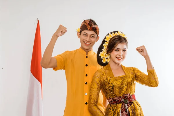 Excited Balinese Couple Put Hands Looking Camera Brown Background — 图库照片