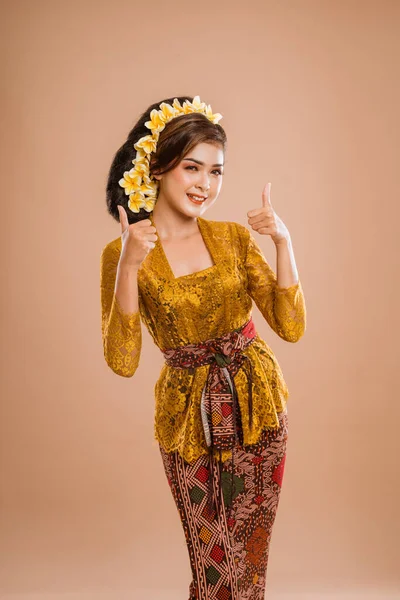 Happy Young Balinese Woman Showing Thumb Gesture Camera Isolated Background — Stockfoto