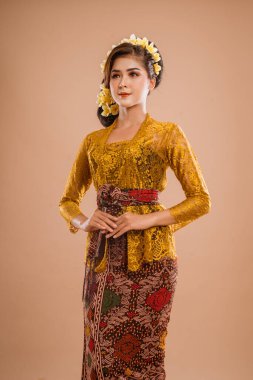 pretty asian balinese woman wearing kebaya over isolated background