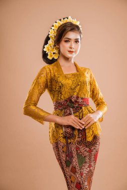 pretty asian balinese woman wearing kebaya over isolated background
