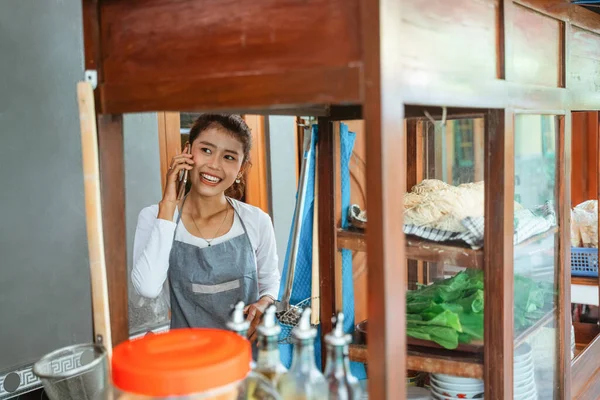 Female Salesperson Apron Making Phone Calls While Cooking Cart — Stok fotoğraf