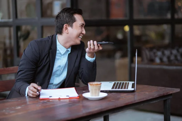 Smiling Asian Businessman Having Phone Call While Working Alone Cafe — Stok fotoğraf