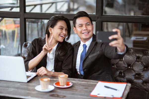 Happy Business Couple Taking Photo Herself Using Smartphone — Stockfoto