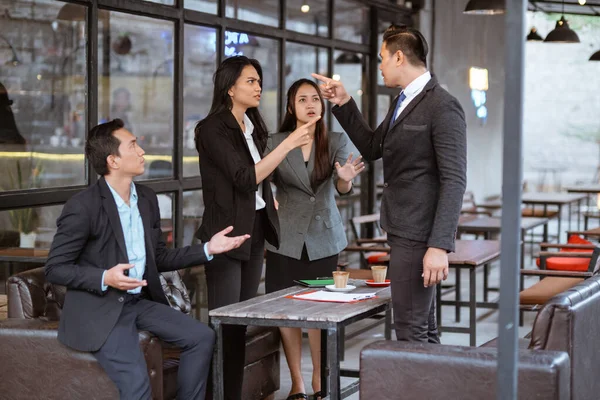 portrait of asian business people having an argument during meeting with partner