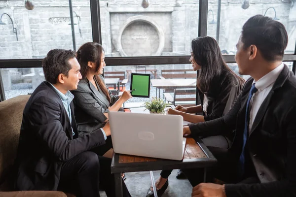 business team presentation when having a meeting in cafe during lunch time