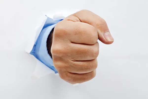Бізнесмен кулак через папір — стокове фото