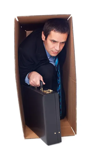 Businessman inside of a cardboard box — Stock Photo, Image