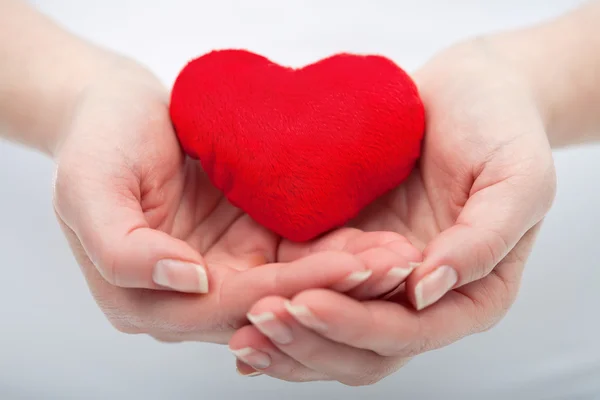 Woman holding red heart — Stock Photo, Image