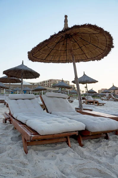Sun loungers on a beach — Stock Photo, Image
