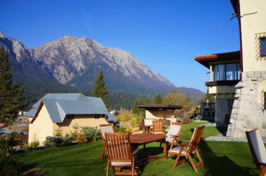 Mountain chalet with a beautiful panorama clipart