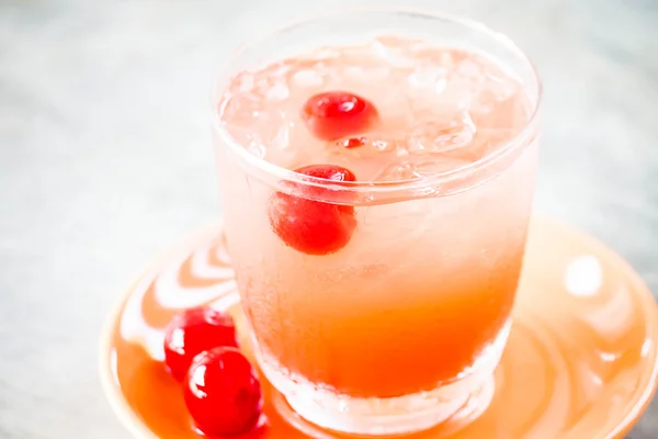 Glass of mix fruits juice soda with cherry — Stock Photo, Image