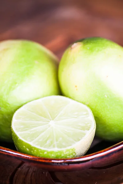 Close up fresh citrus lime wholes and slice — Stock Photo, Image