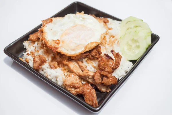 Egg fried and fried pork garlic with soy sauce topped on rice — Stock Photo, Image
