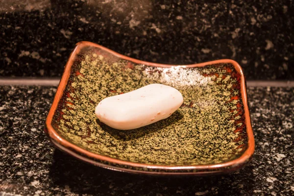 Herbal hand soap bar on ceramic tray — Stock Photo, Image