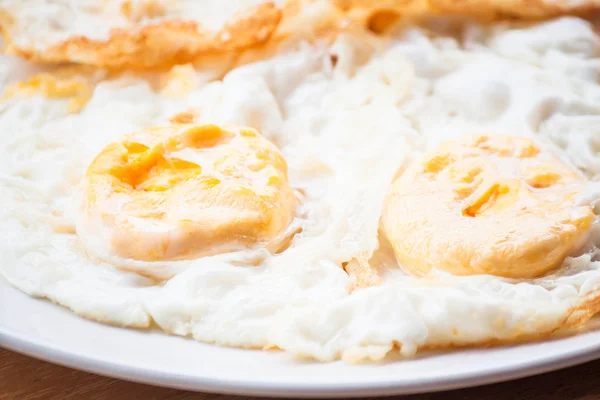 Double star eggs serving on white plate — Stock Photo, Image