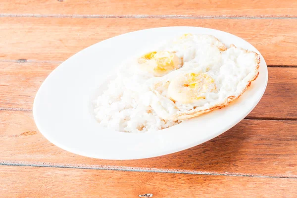 Double star eggs topped on dish of rice — Stock Photo, Image