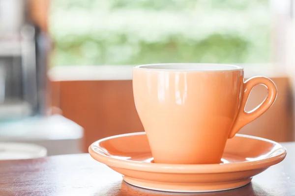 Bodegón con taza de café espresso naranja — Foto de Stock