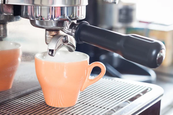 Orange coffe cup prepares for espresso — Stock Photo, Image