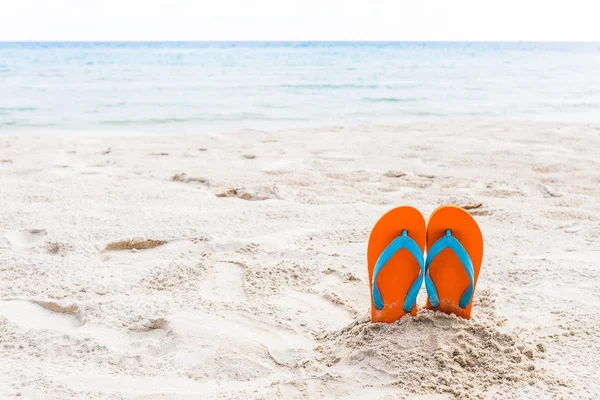 Sandals on beach — Stock Photo, Image