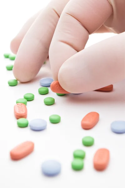 Pills and hand — Stock Photo, Image