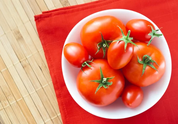 Tomatoes in bowl — Stock Photo, Image