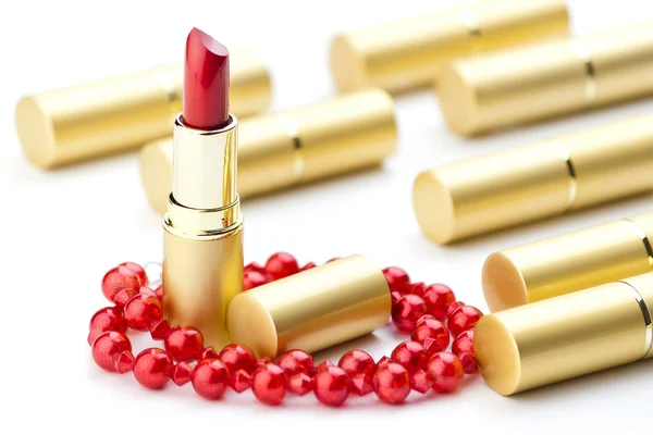 Goldene Lippenstifte — Stockfoto