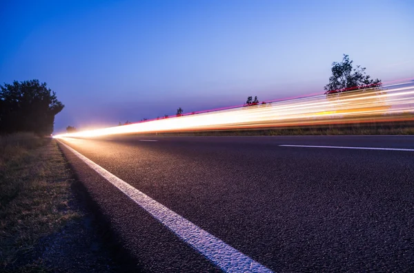 Light streaks on road — Stock Photo, Image