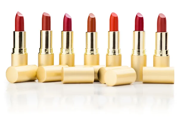 Row of red lipsticks — Stock Photo, Image