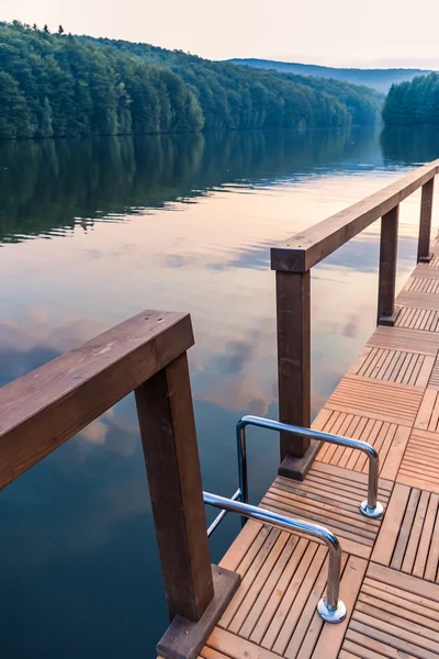 Stairs railing on lake dock — Stock Photo, Image