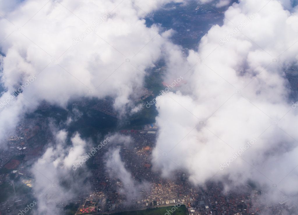 City from above through clouds