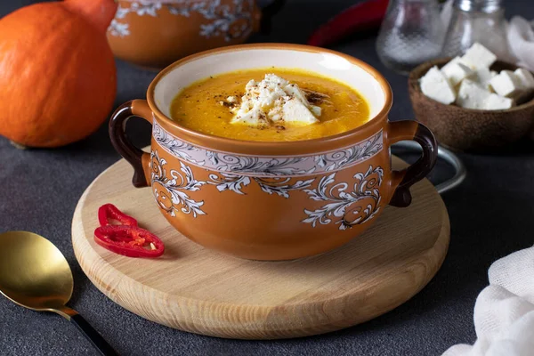 Pumpkin Cream Soup Feta Cheese Brown Bowl Wooden Board — стоковое фото